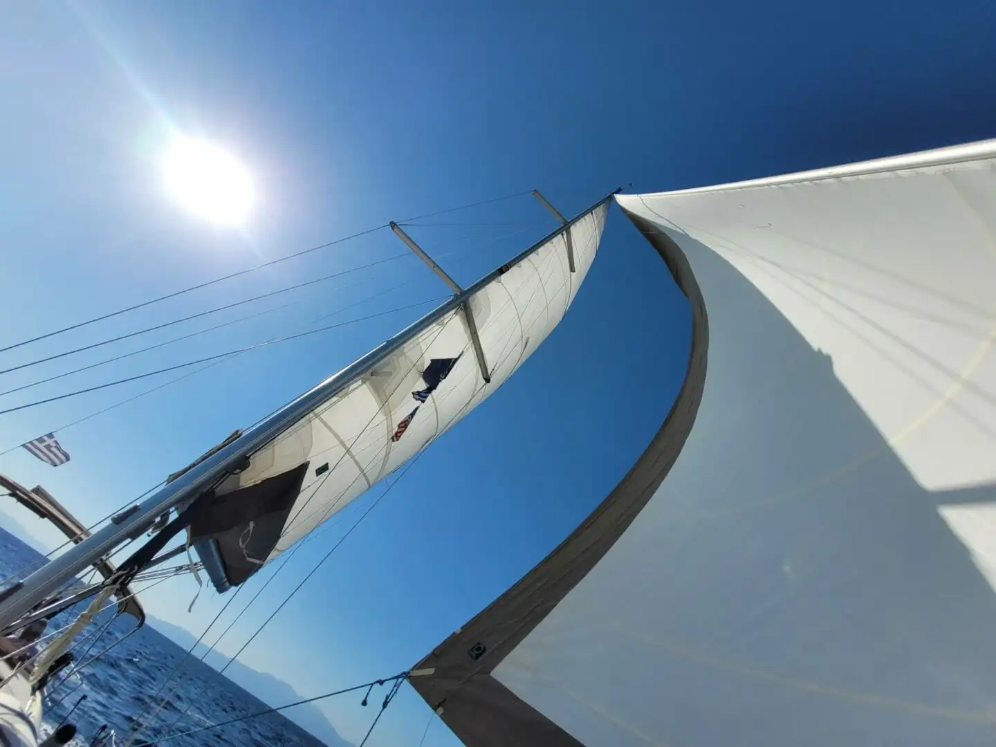 A sailing yacht at anchor off the Ionian coast