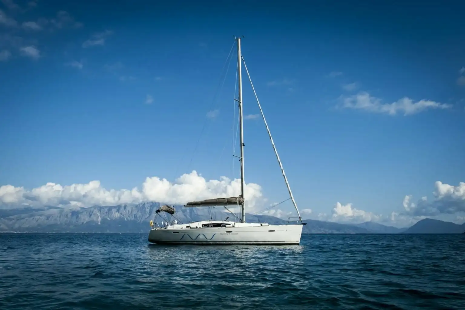 Oasis, a Beneteau Oceanis 43, sailing in open Ionian water