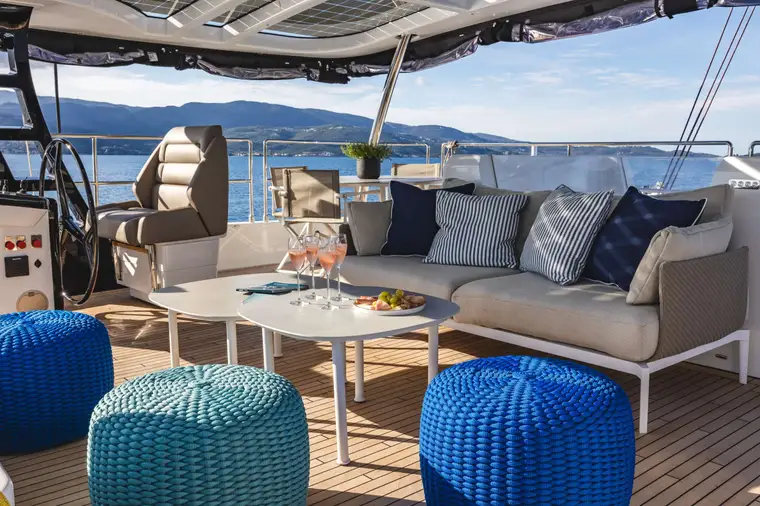 Shaded flybridge lounge with sea views