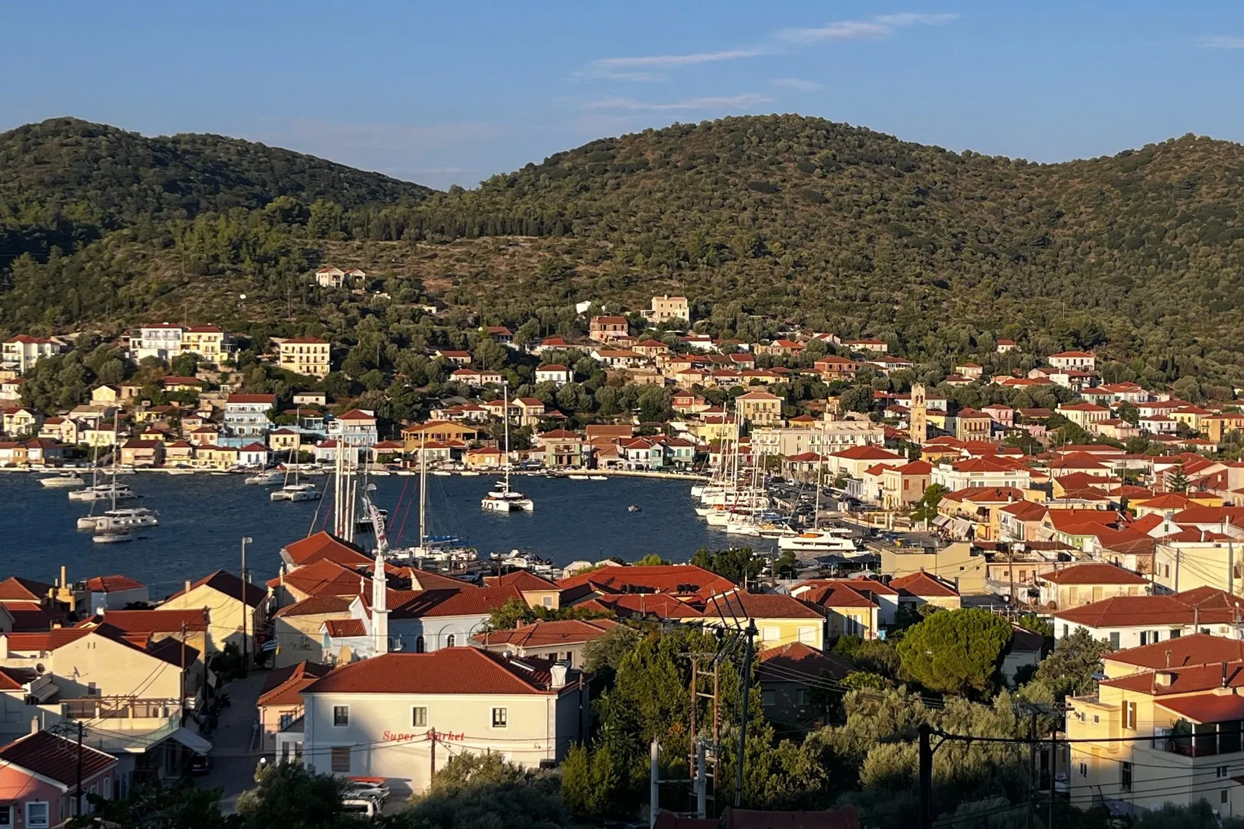 Vathi, Ithaca - Oasis Sailing Vathi on Ithaca from above, red roofs around the harbour and yachts along the quay