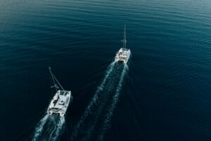 two boats in the middle of the ocean